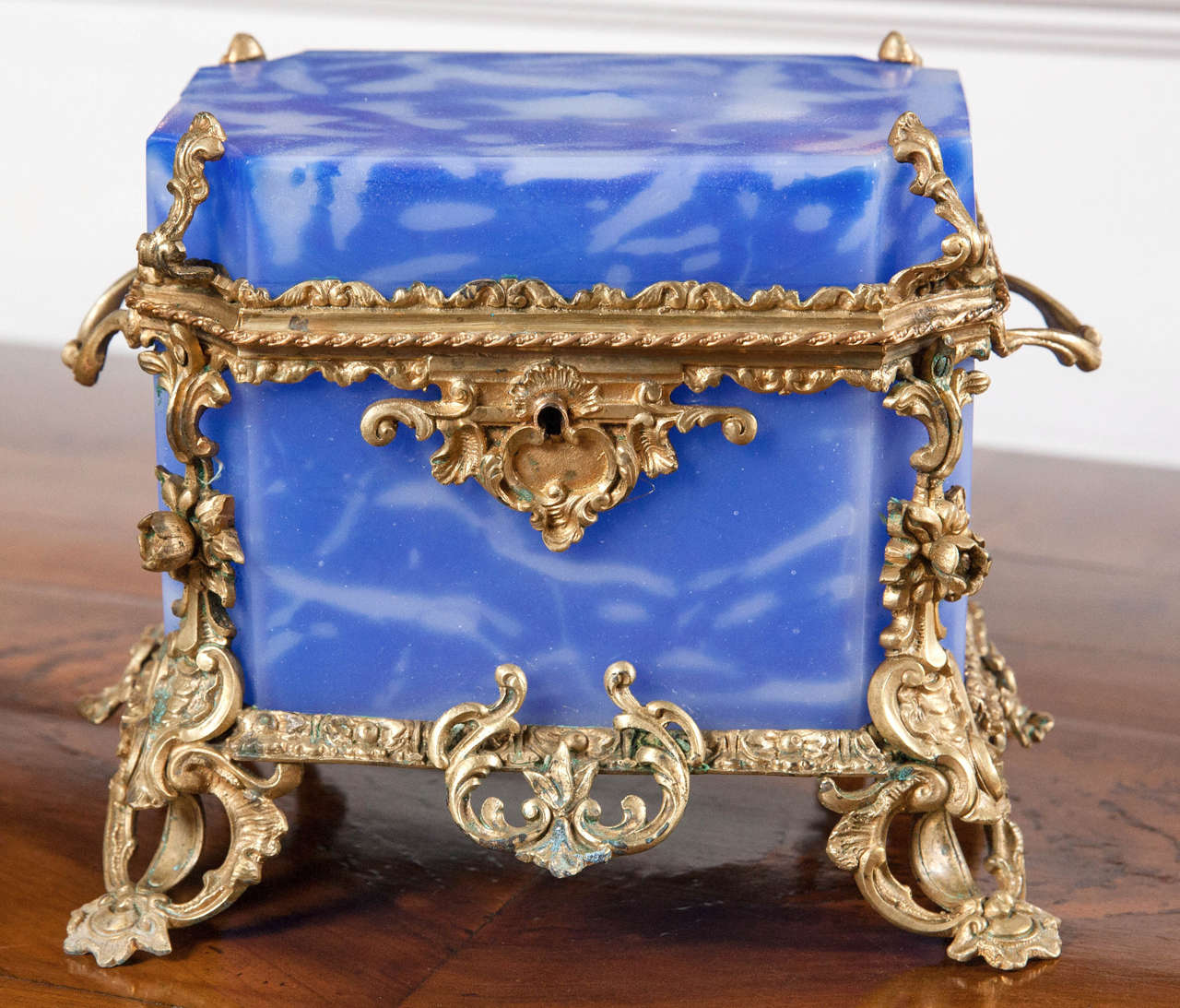 An antique French opaline rectangular hinged cover glass box with an etched blue swirl design and Fine bronze mounts.