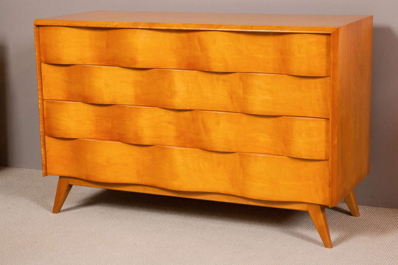 Swedish sculptural chest of drawers by Edmond Spence with wave front design.

Newly Refinished.