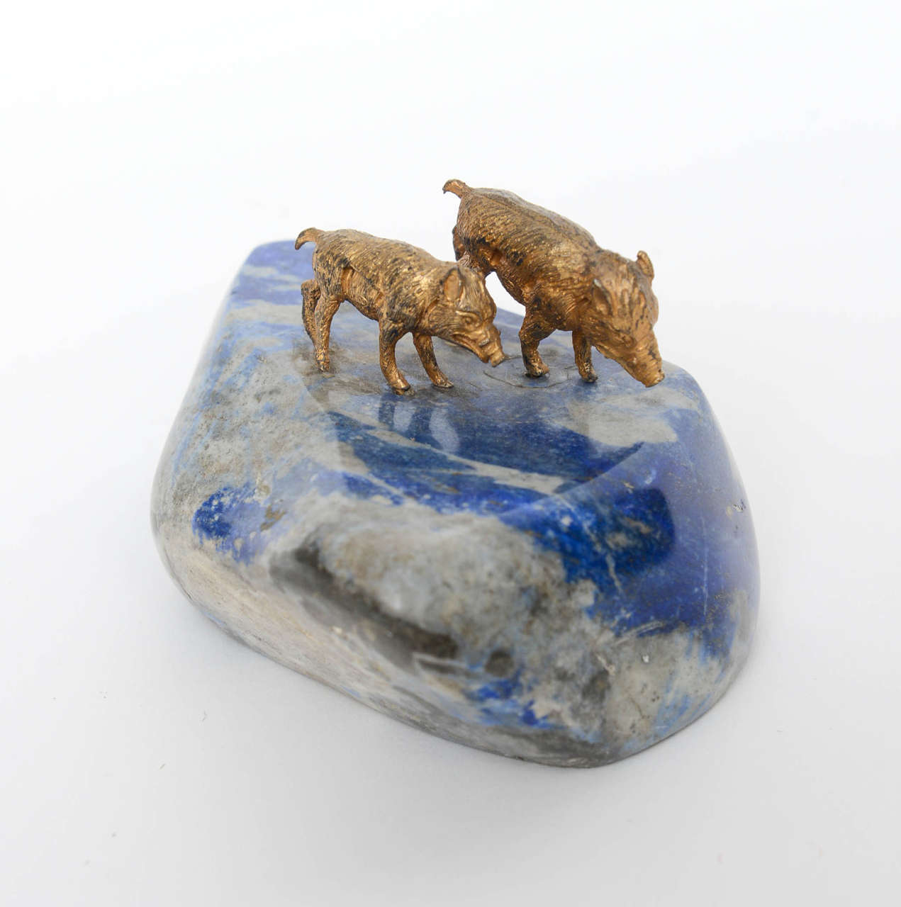 Wonderful miniature pair of bronze boars set on a free-form, polished piece of lapis lazuli stone. Ideal as a paperweight

Originally $350.00

Lapis in the form of two dragons with ball and stand, original condition; Lapis lazuli (sometimes