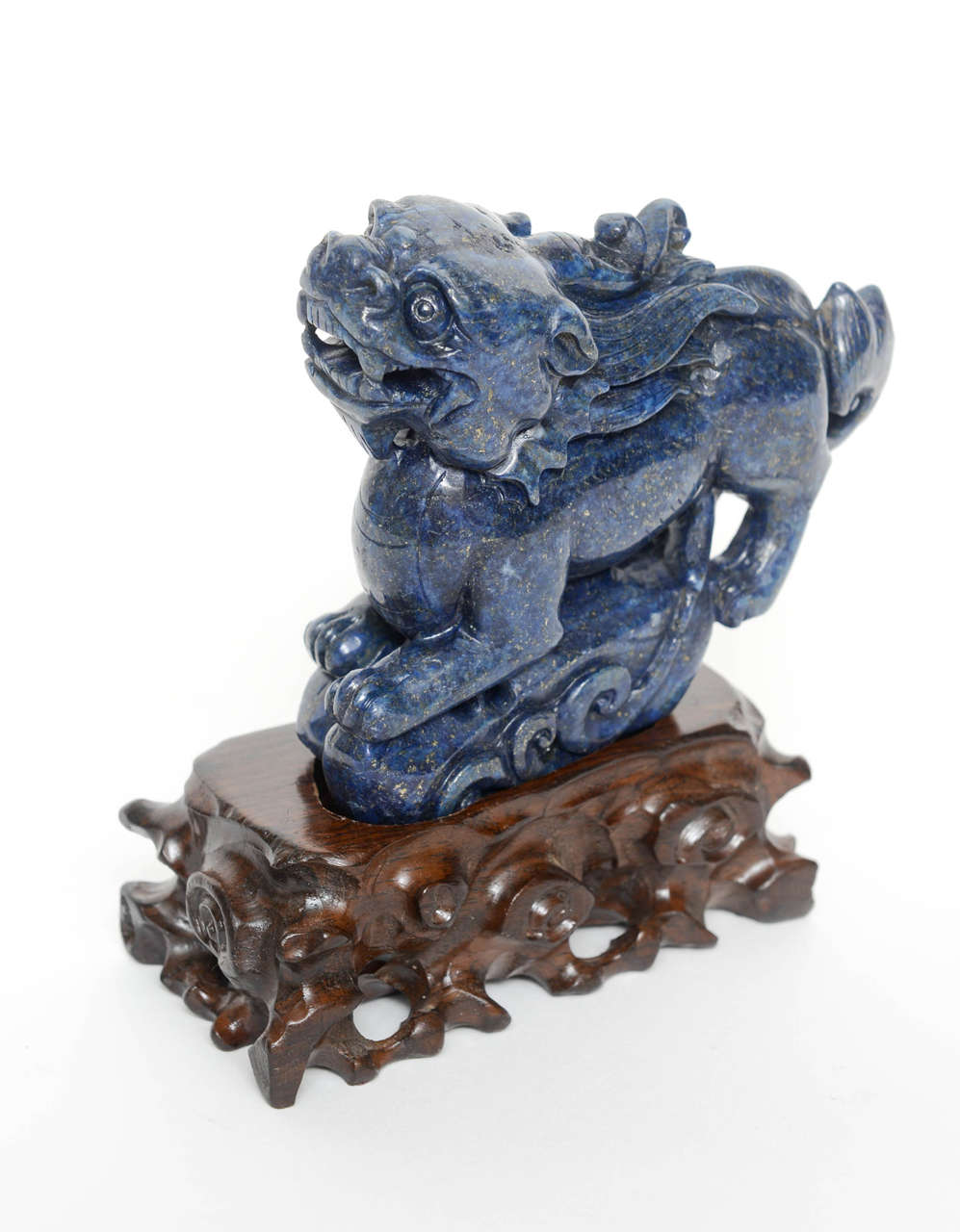 Beautifully carved lapis lazuli sculpture on a custom, hand carved base which is not attached.

Sculpture is 4.5