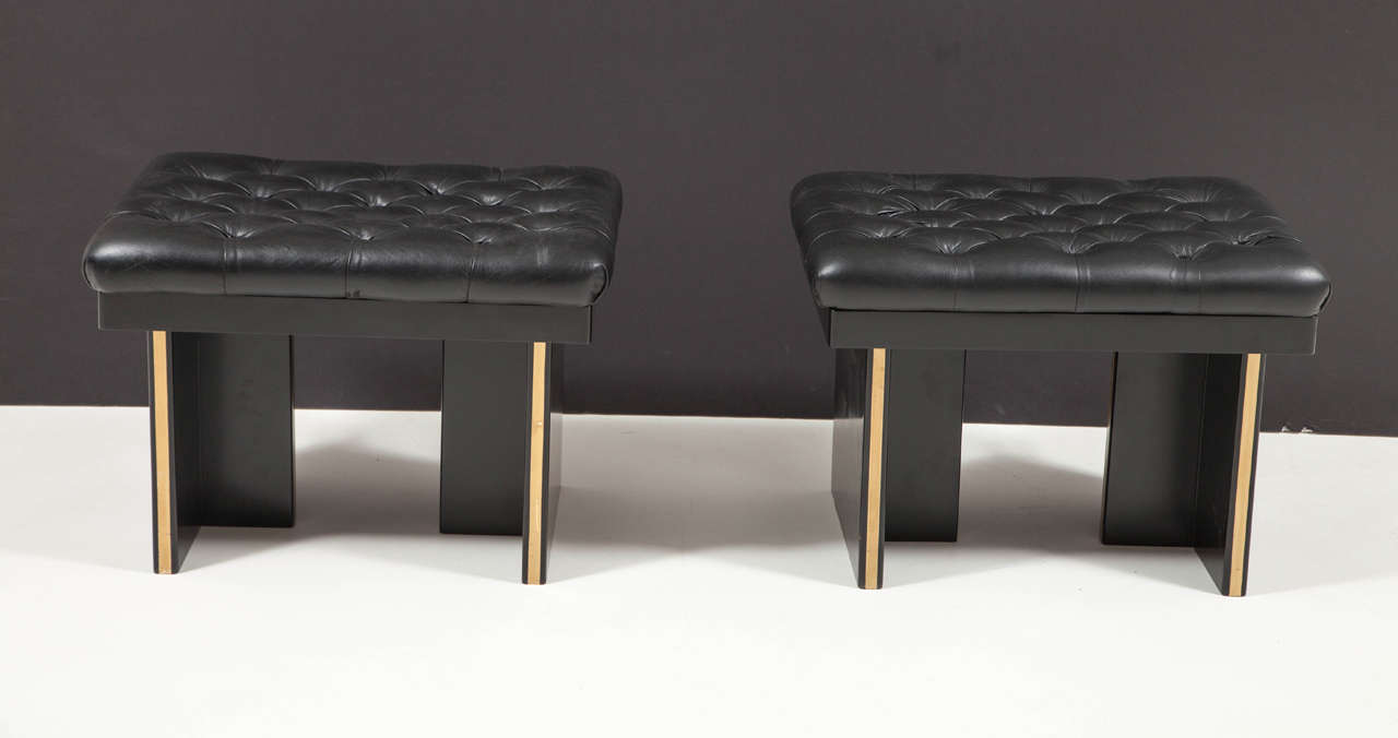 Black lacquered with gold inlay and tufted black leather.