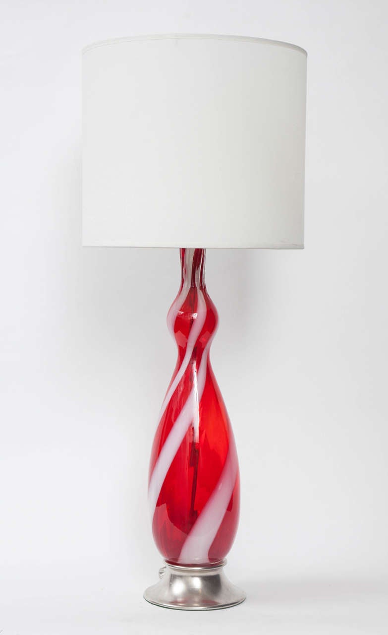 Fantastic pair of Murano glass lamps in a raspberry color with a white spiral on satin nickel bases. Rewired with new sockets and cords.