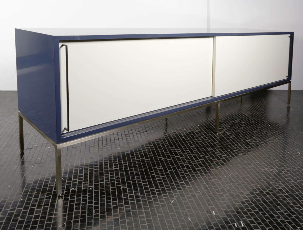 re:379 high gloss grey lacquered credenza with white lacquered doors and stainless steel frame.