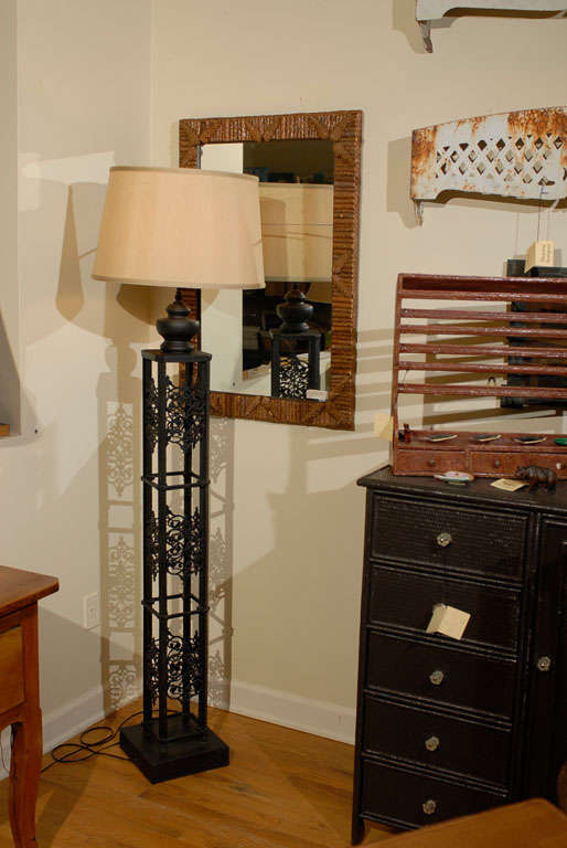 This antique gate post from France has been turned into a floor lamp.  The handsome lamp has iron details on all four sides.  This lamp looks lovely from all sides.

Please visit our website for more pieces.
www.dearingantiques.com
Dearing