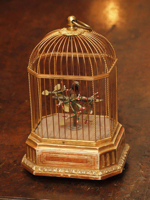 French Gilt Metal and Gilt wood automaton singing feathered bird in guilded cage.