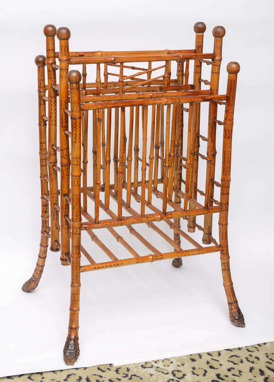 Scorched bamboo magazine rack with root ball feet, three compartments, ball tops.