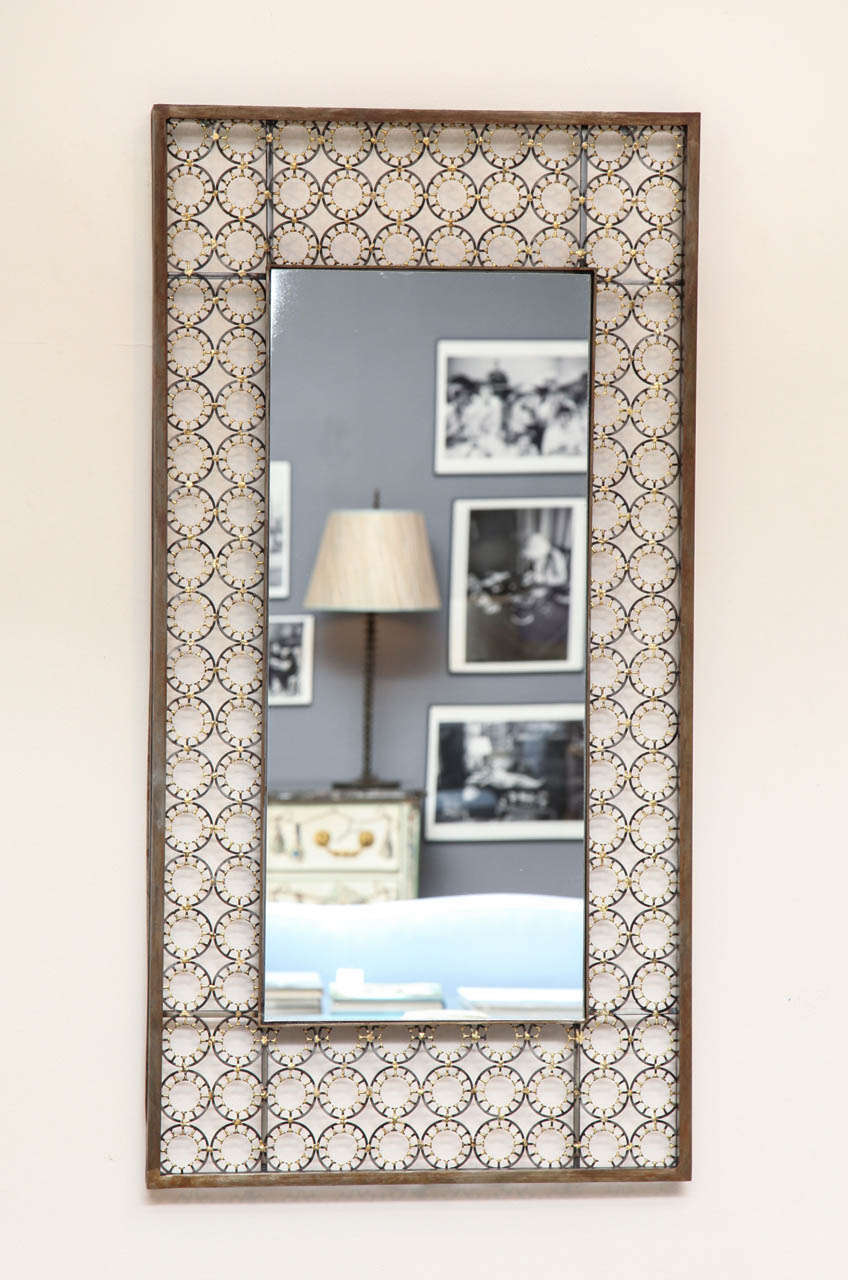 Marie Suri
The ovation mirror
Rectangular wall mirror with steel medallions and bronze decoration in a patinated steel frame with mitered corners. Custom inquires welcome.
Made to order expressly for Liz O'Brien.