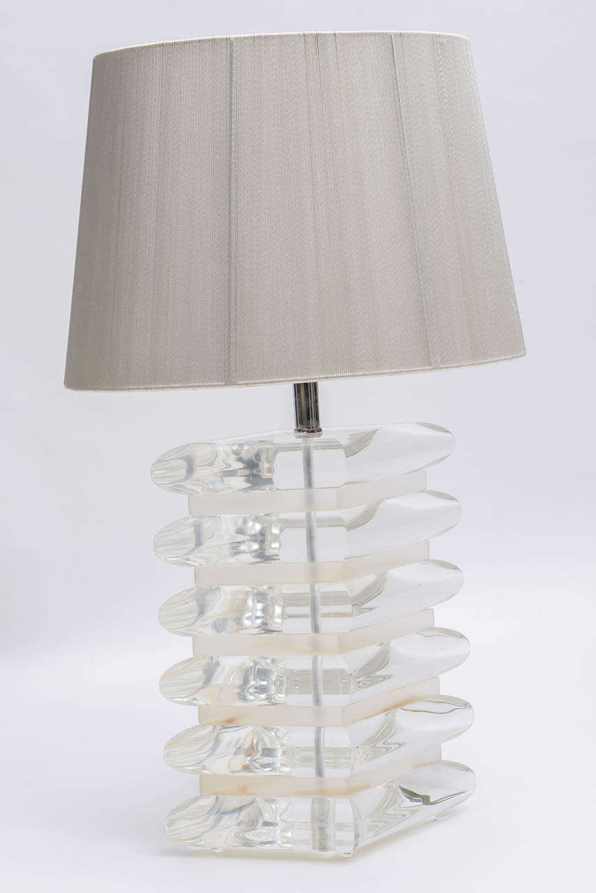 Vintage rounded edge polished diamond shaped tiers alternate with shorter straight edged satin finished diamond shape tiers to form the body of this single table lamp.  Chrome hardware and oval  string lampshade are included.