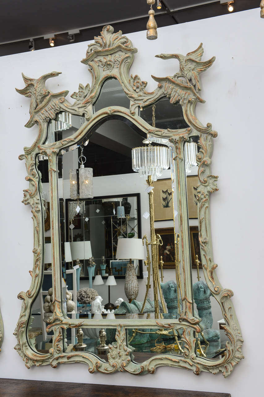 Pair of painted and carved French style mirrors with light green finish highlighted with soft gold accents.