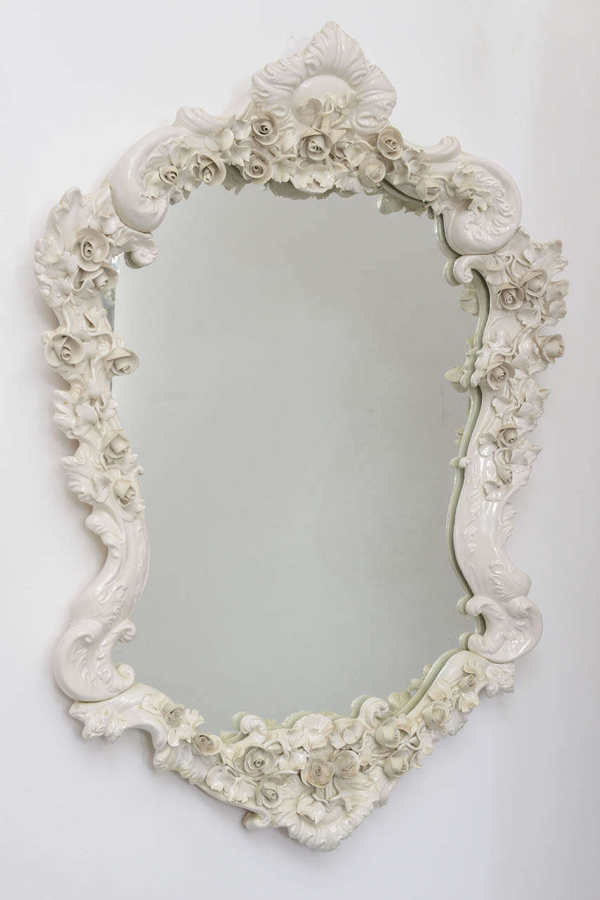 French porcelain mirror -- eggshell in color- with delicate rosette motif.
