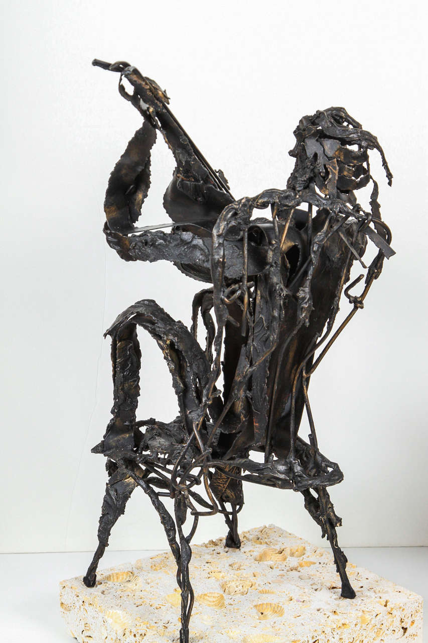 Metal Sculpture of Man Playing Guitar 1