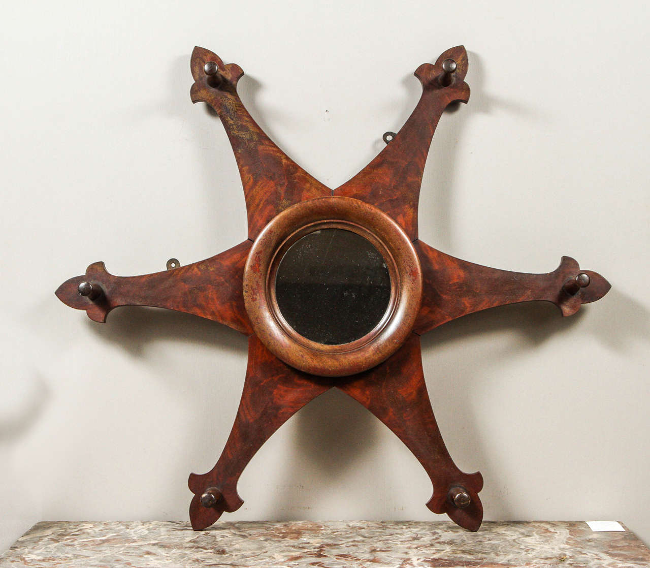 A U.S. circa 1920's wooden hat rack and mirror.