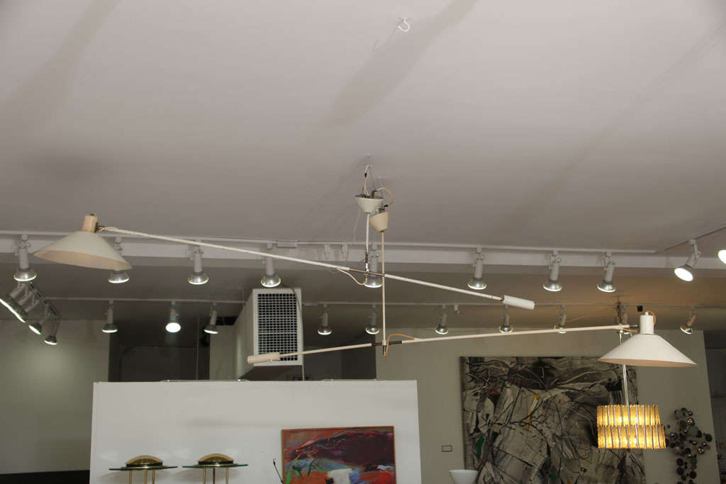 Large counterbalance ceiling lamp by J.J.M. Hoogervorst for Anvia. We have one available (two shown).  

*Notes: There is no sales tax on this item if it is being shipped out of the state of Florida (Objects20c/Objects In The Loft will need a copy