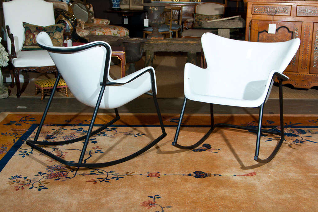 Very Comfortable pair of Rocking chairs by Lawrence Peabody.  The bases were powder coated a few years back and the white enamel paint does show cracks the base and rear.  The cracks do not come thru and compromise the safety but are in the surface.