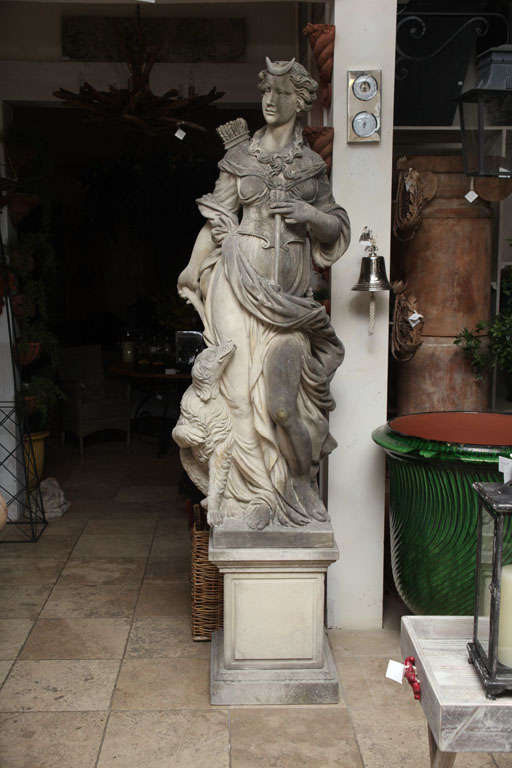EXCEPTIONAL GODDESS OF HUNT AND EMBLEM OF CHASTITY<br />
SHOWN WITH THE HUNTING DOG, PLACED ON PEDESTAL<br />
SHOWCASING BEAUTIFUL DETAIL AND PATINA