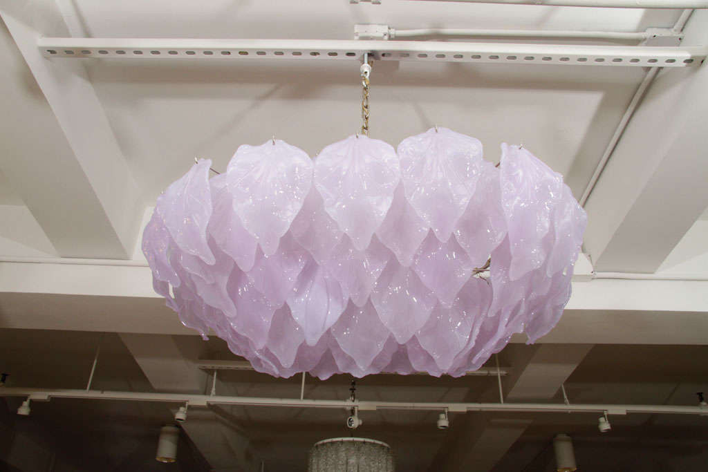 A truly stunning Murano glass, four-tier chandelier composed of glass leaves in a beautiful shade of lavendar.  This piece will add star quality to any room!