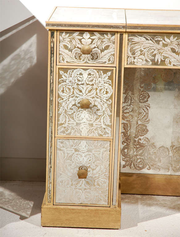 A beautiful and glamorous six drawer veneered vanity by New Era Glass featuring a flip top mirror with storage compartment.  Compartment may be used to house jewelry, cosmetics, or fragrances.  Drawers feature their original seashell drawer pulls. 
