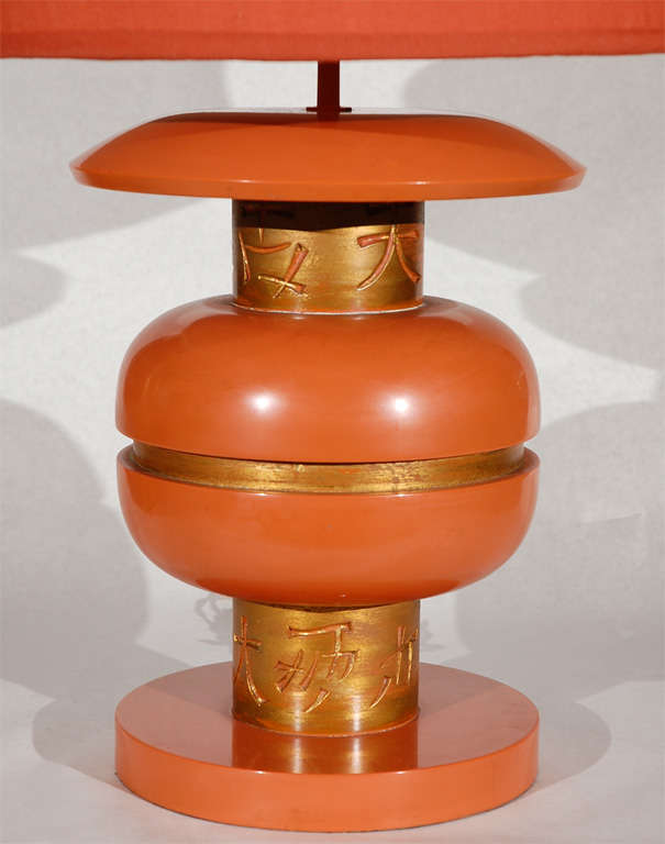 Asian inspired hand carved and lacquered wood table lamp with gold gilt accents designed by James Mont in the 1950's.  This lamp was purchased directly from Mont in 1952 by the original owner.  Original shade has been recovered with new fabric. 