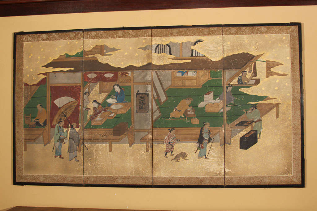 A small Japanese four-panel folding screen (byobu) depicting an Edo period cityscape with merchants and craftsmen; the foreground with sarumawashi (professional showman) and his trained monkey. The painting mounted as a screen with silk border and