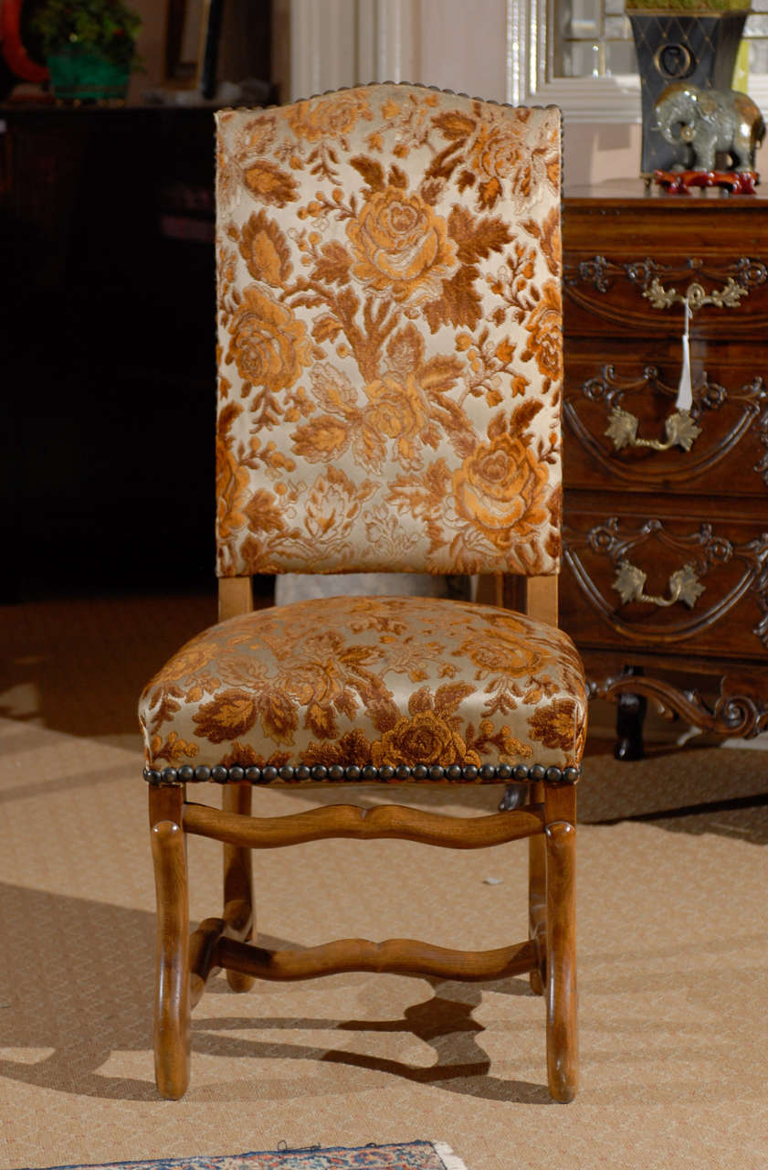Lovely set of 8 Country French dining chairs with upholstered backs and seats with nail trim.