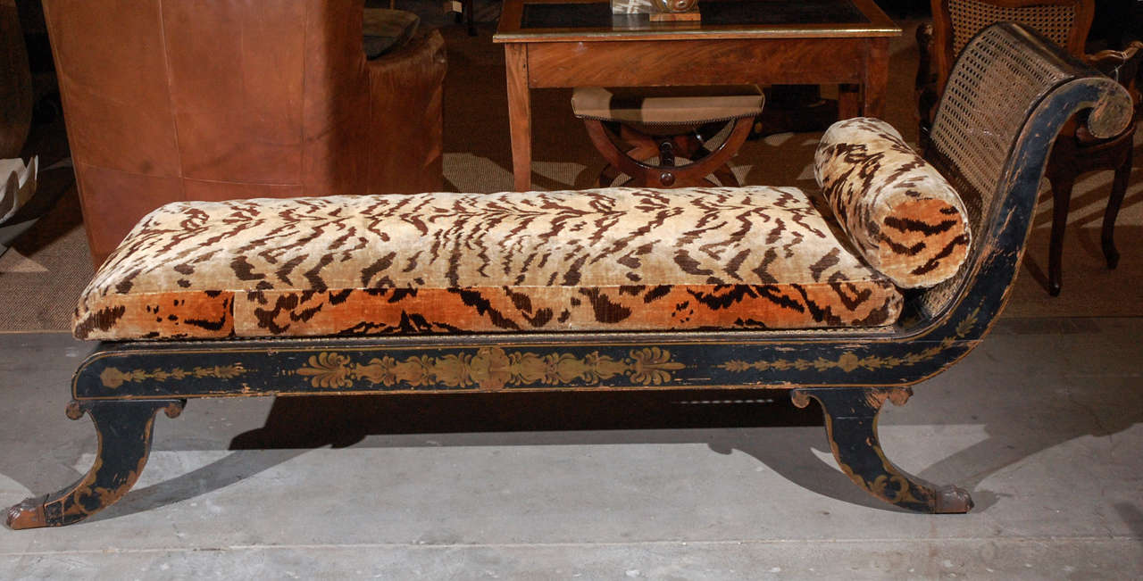 early 19th century Regency stencil decorated ebonized chaise longue with leopard print upholstery