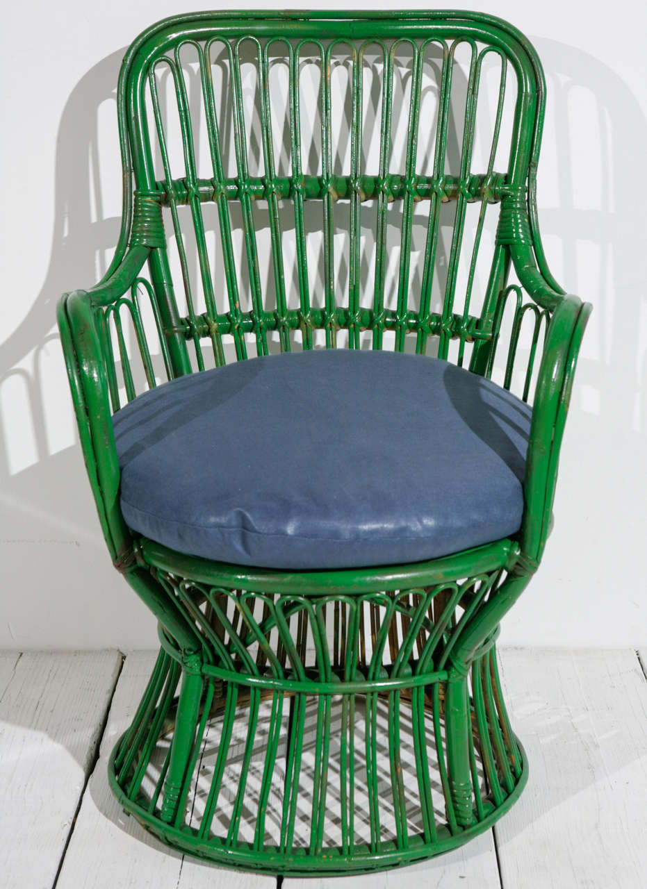 Italian style Kelly green painted wicker armchair with newly upholstered blue round cushion. 