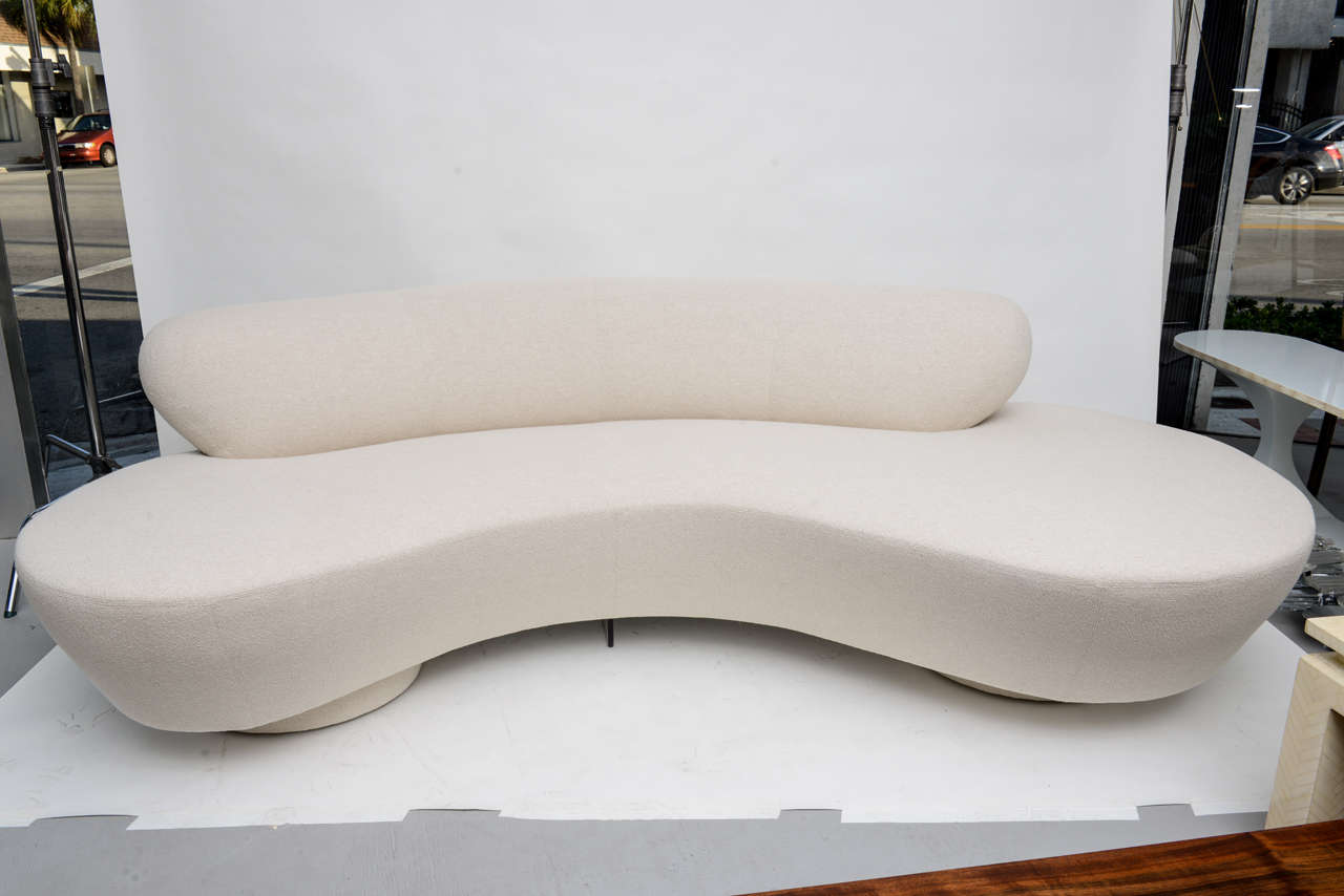 Stunning serpentine sofa by Vladimir Kagan for Directional. Newly upholstered and ready for the beach in creamy white linen boucle.