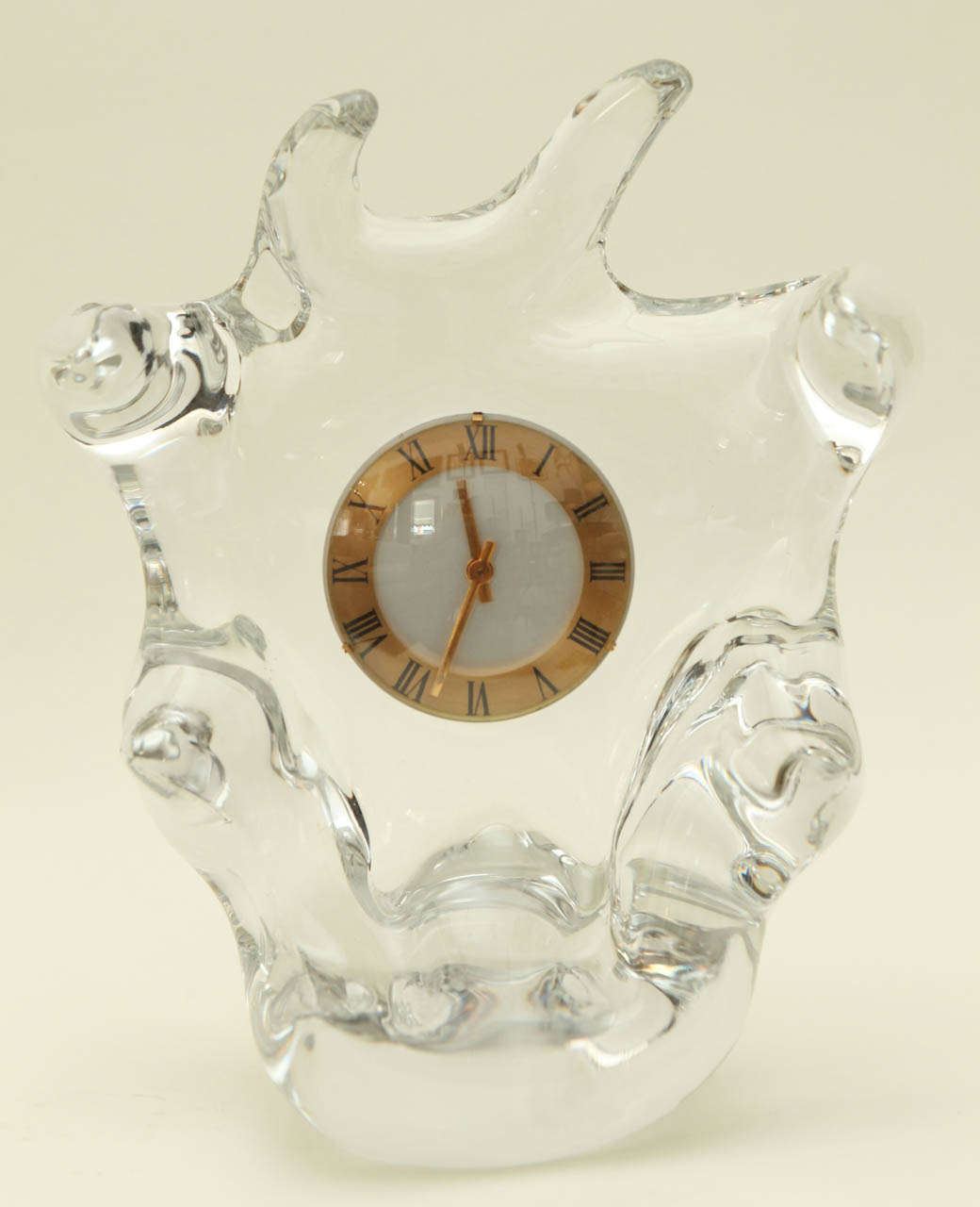 A biomorphic crystal clock by Schneider Glass. Signed on the underside with the Schneider name (see Image 10). The 8-day movement is by CH Mour of France.
