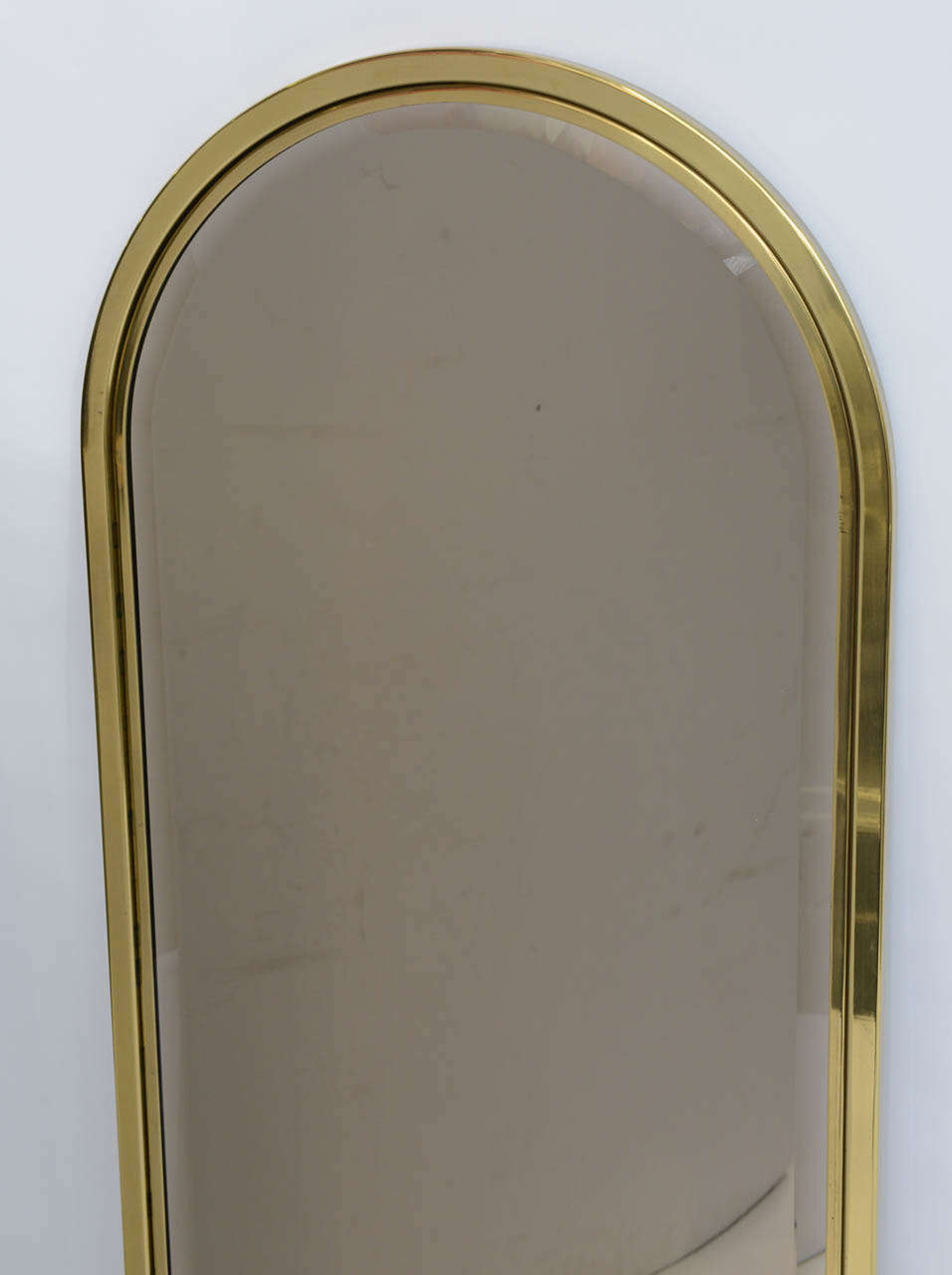 arched brass mirror