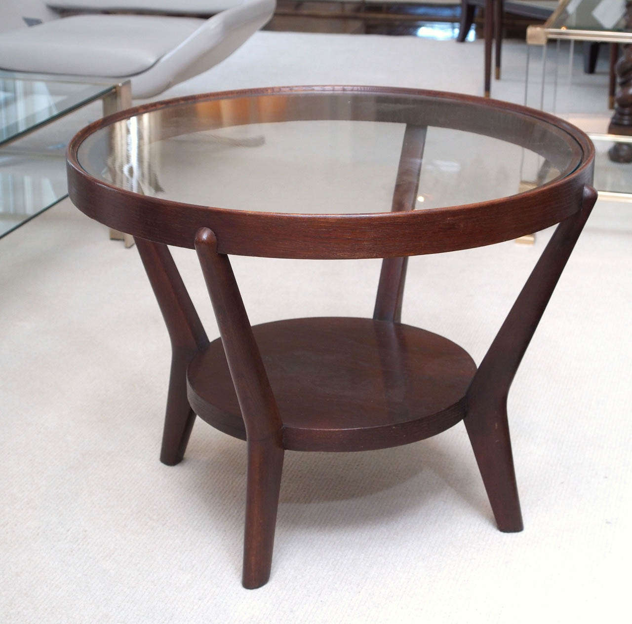 Two-tier side tables in dark stained oak with inset glass at the upper level