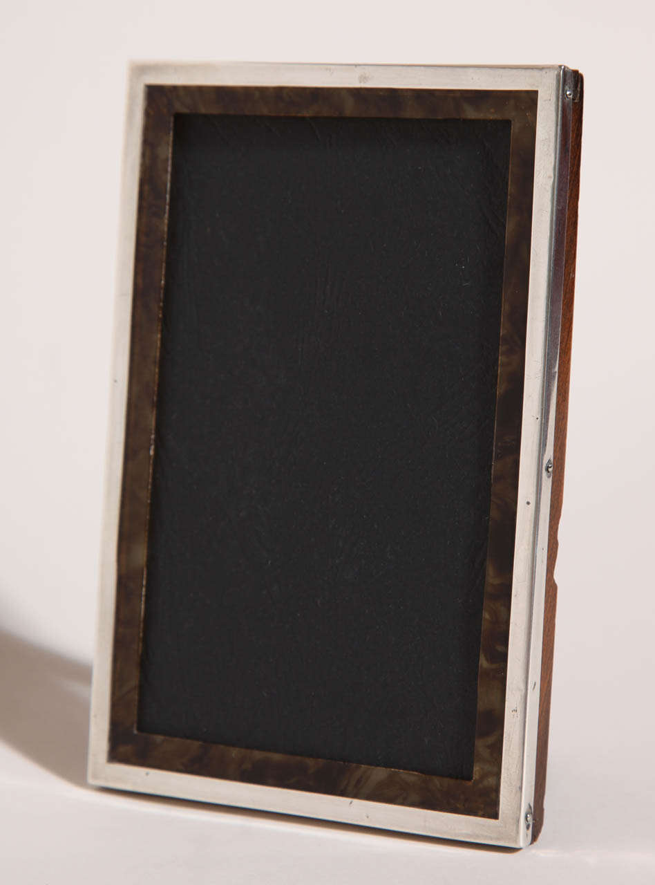 English Art Deco sterling silver and faux tortoiseshell photograph frame with original wood backing.
Hallmarks: for 925 silver/ Birmingham/ 1924/ S & M.

(Price shown is reduced price, no further trade discount) 