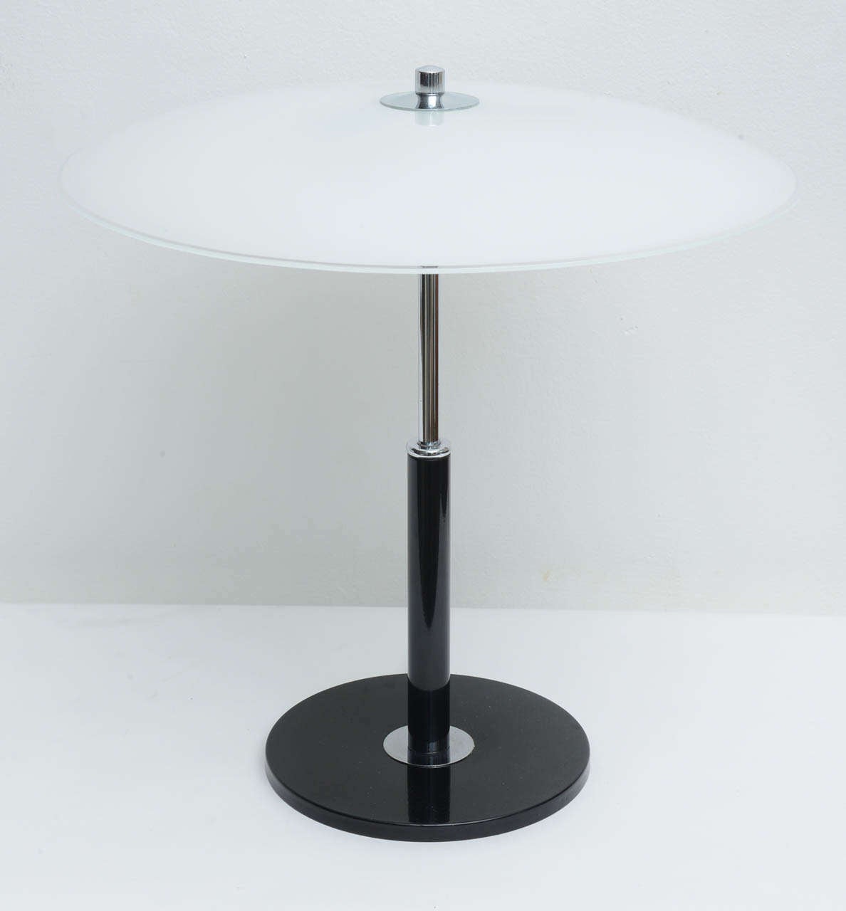 This simple and minimalist lamps have a leather stem and glass shade , metal base . They are all original and date to 70,s . They have an Arteluce or arredoluce design quality to them .