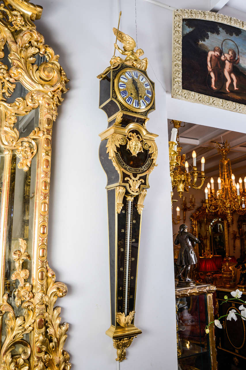 Wall clock black scale and gilded bronzes.