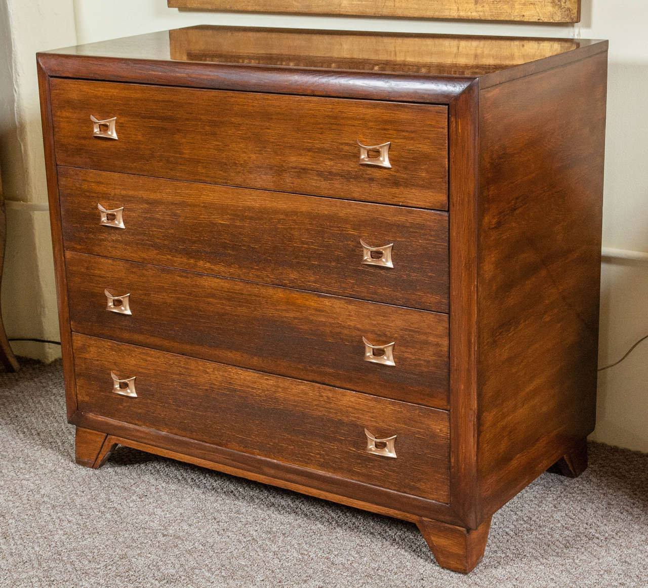 Mid-Century commode chest with brass pulls. The top two drawers have three removable wooden slide dividers. The bottom two drawers are not divided. This is a spacious piece that is clean lined and functional. Custom cabinet maker made this chest. It
