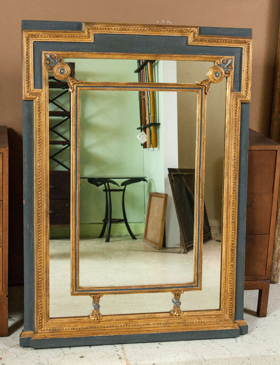 A parcel paint and gilt gold decorated wall or console mirror. A wooden rectangular Swedish style paint decorated mirror. The gray paint frame surrounding a gilt gold rectangular molding forming a three dimensional box. This fine quality mirror
