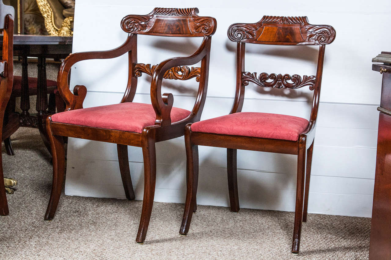 Set of eight fine matched English Regency period dining chairs feature the bold scrolling lines of the Greco-Roman styles. Known as a 