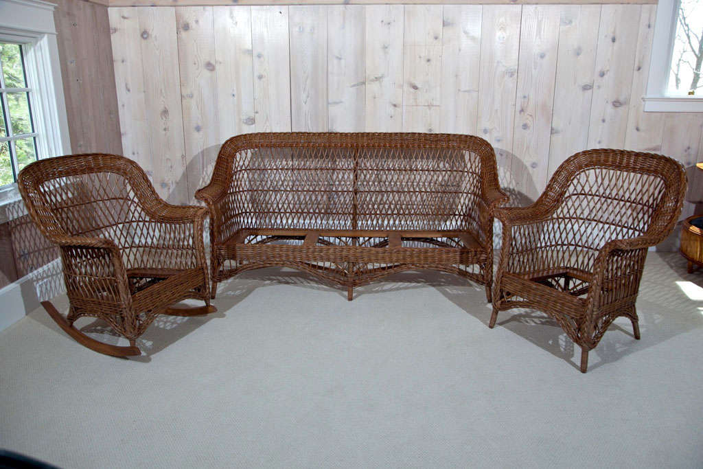 Three piece antique Bar Harbor Wicker Set in natural stained finish.  Original drop in spring cushions accompany the set but will need reupholstering.