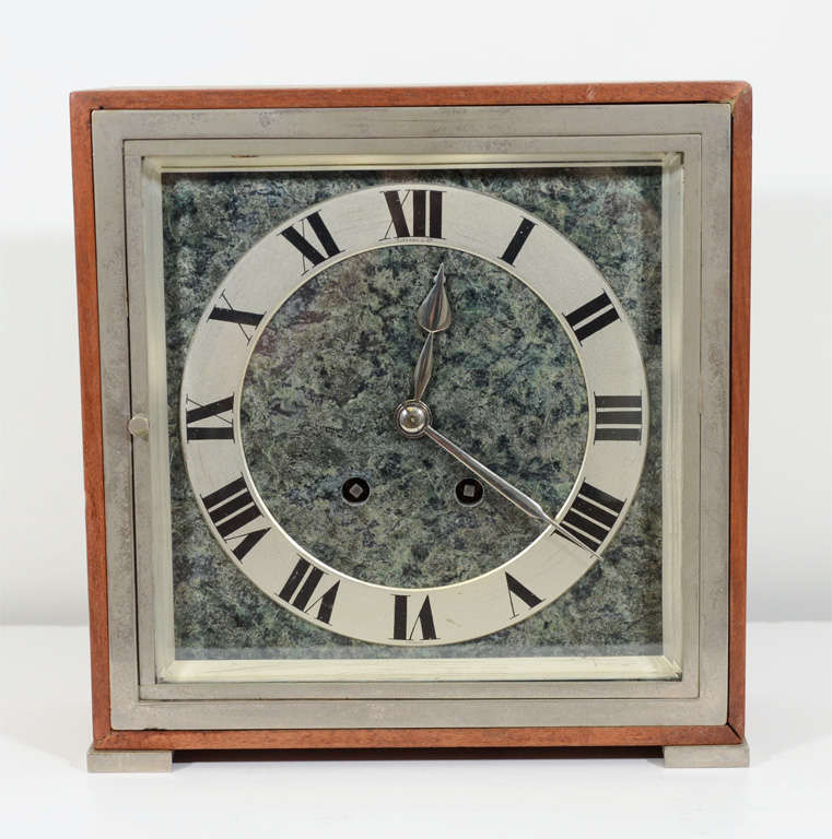 1920's Tiffany and Co table clock. mounted with marble, wood and Chrome with an enamel dial.