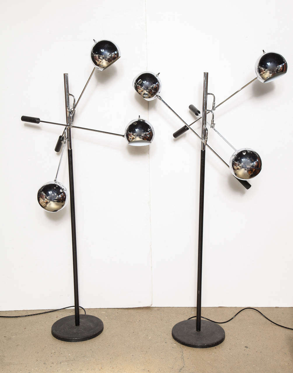 2 Mid Century cantilevered and Chrome and Black lacquered space age Triple Boom Lamps by Robert Sonneman for Lightolier.  The Globe shaped vented Shades rotate 360 degrees and pivot 120 degrees. Each Boom measures 33