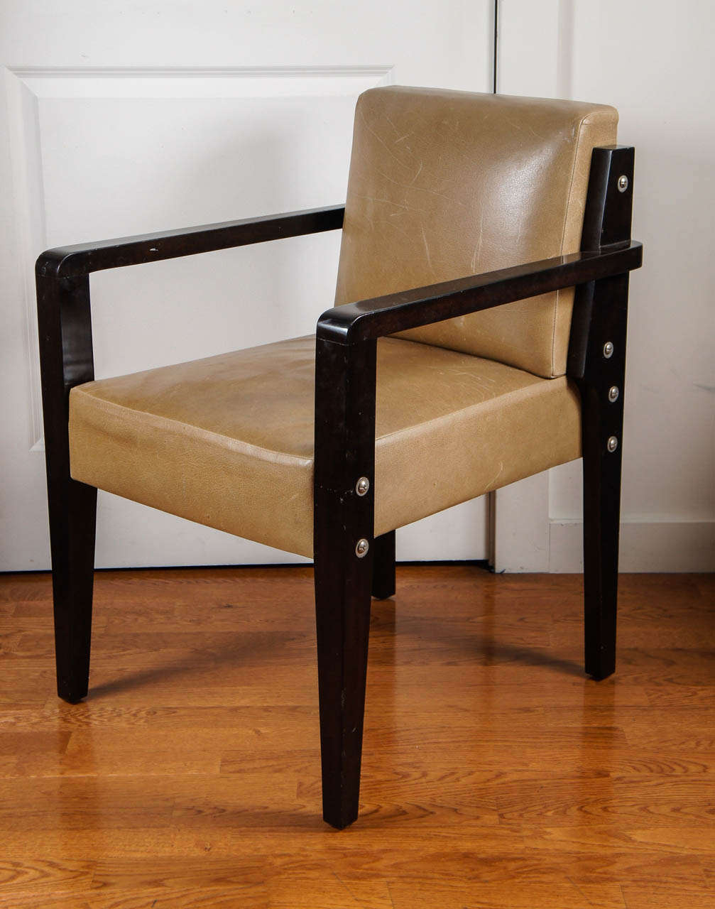 in the manner of Paul Dupre-Lafron, this handsome armed dining chair is upholstered in tan leather, with silver nail-heads, detailing, the mahogany wood frame.
a quantity of 10 are available.