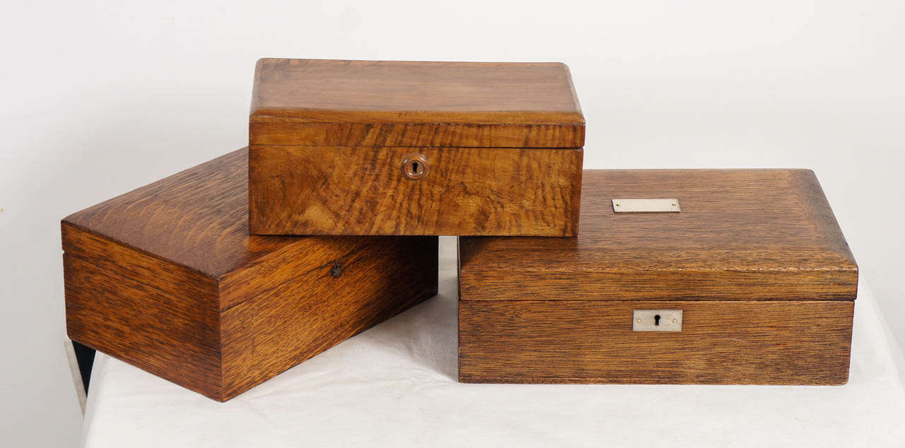 a wonderful assortment of wooden boxes, individually sold.
made of various woods and interiors. one has wooden compartments, one is lined in silver. each box is unique and interesting on their own, or stacked and grouped together.
( dimensions,