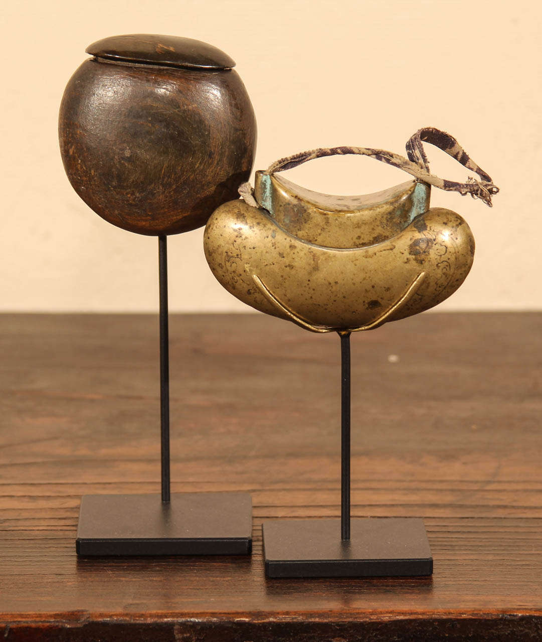 Two Chinese Tobacco boxes. One burl wood box on custom metal stand. Second in brass on custom metal stand:
A. on left on stand: 7.75