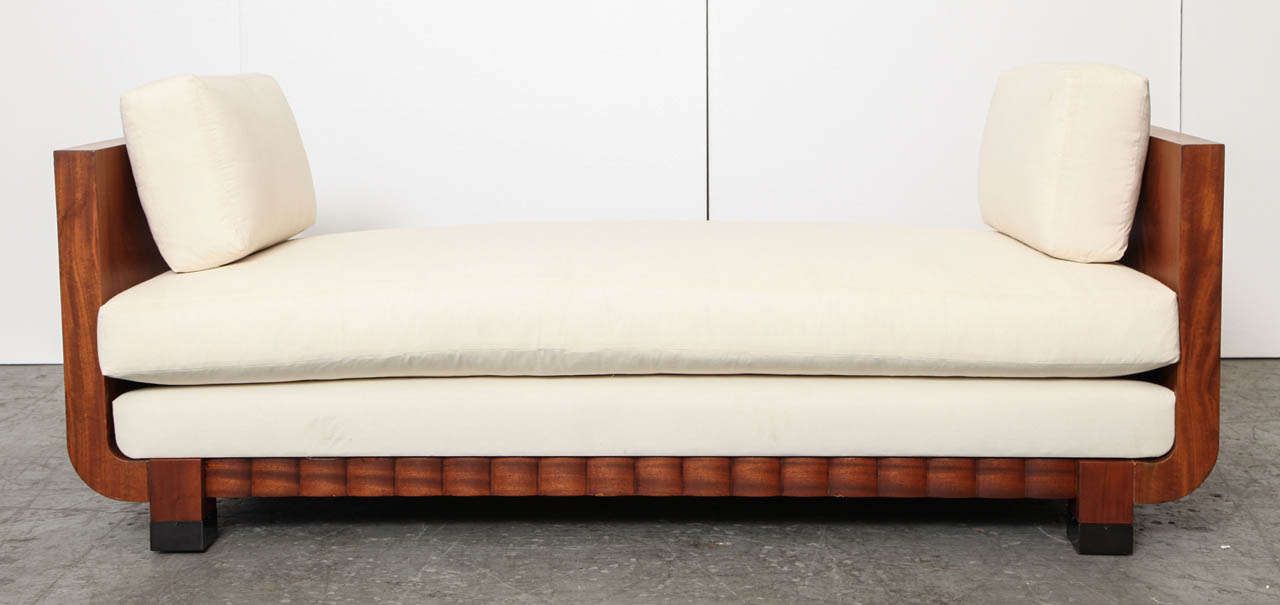 A 1930s Travail Francais daybed with sculpted concur base and adjustable back.