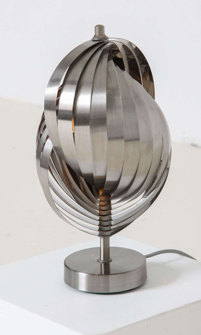 Henri Mathieu stainless steel table lamp, France circa 1970
Formed of radiating strips issuing from central shaft.