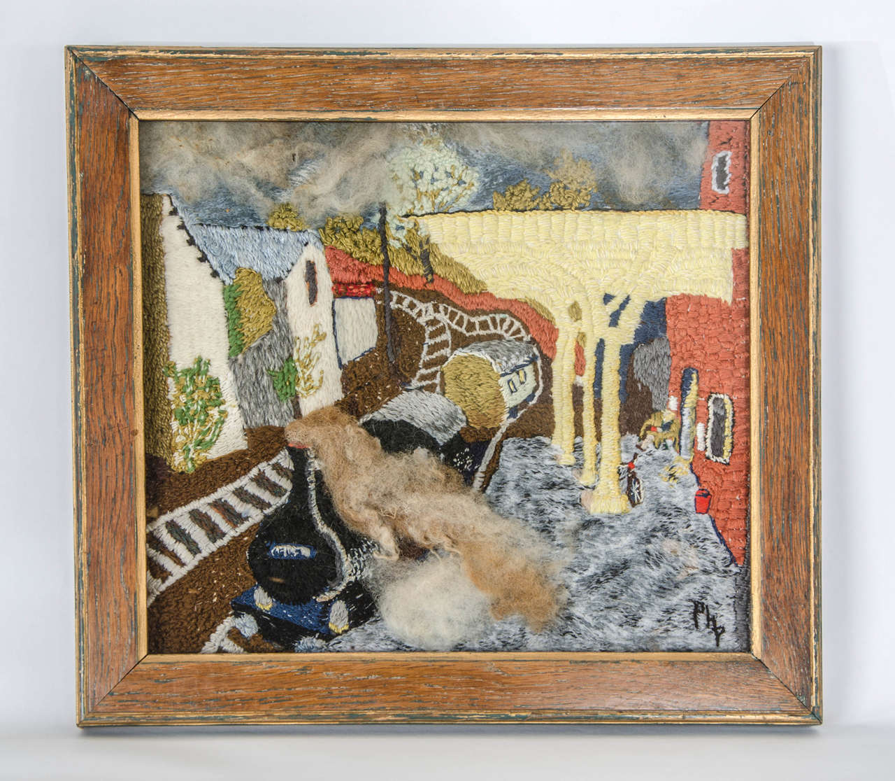 A charming mid 20th century wool work picture of a train leaving a rural station, in a wood frame.
