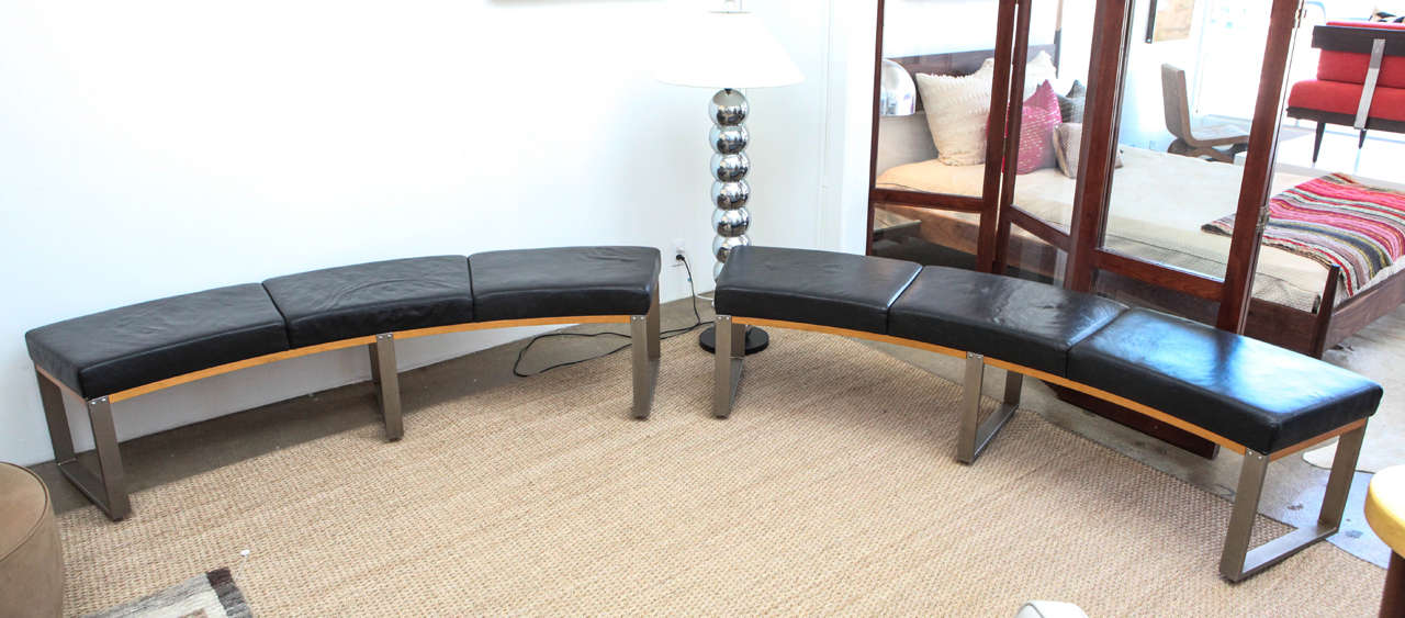 Two black leather benches, can be bought together or separately.