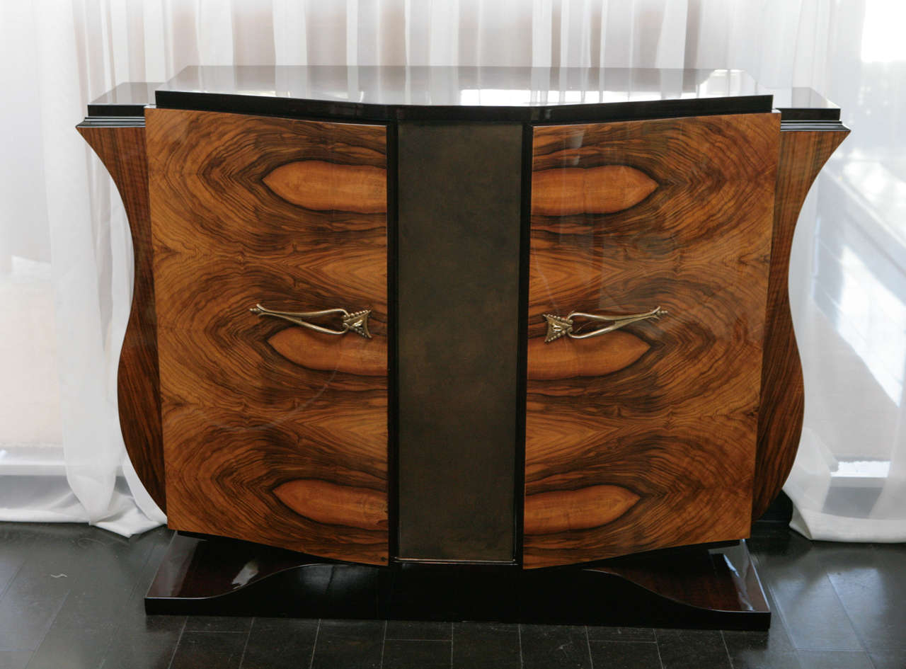 Gorgeous Art Deco walnut burl sideboard from France 1930s. Unique S-curve on sides. Black lacquer on top and dark brown lacquer on base. Antiqued gold leaf finish on middle section. Original Deco gold leaf handles. Opens up to storage space of one