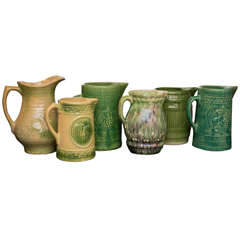 A Collection of 6 Stoneware Pitchers in Shades of Green