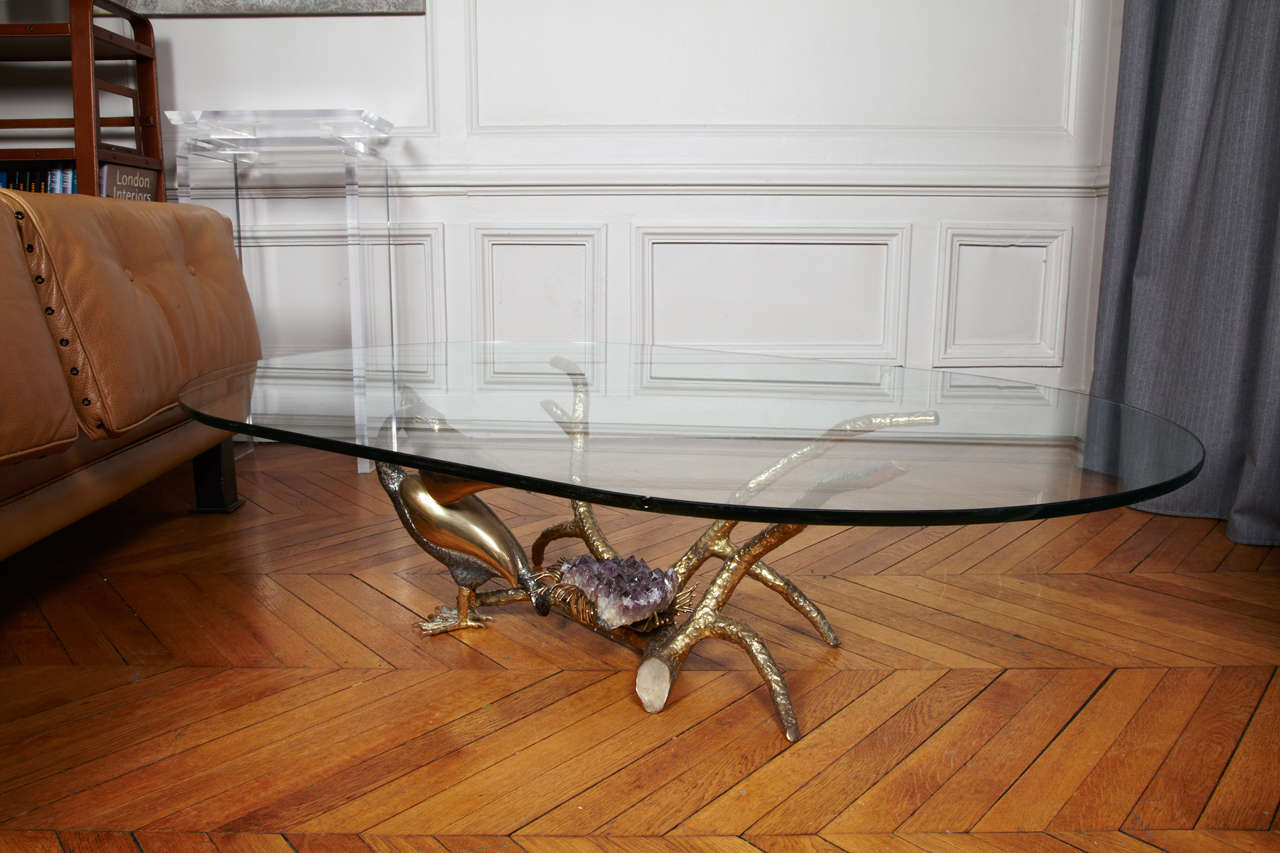 Great coffee table in brass with amethyst.
One ship on the glass.