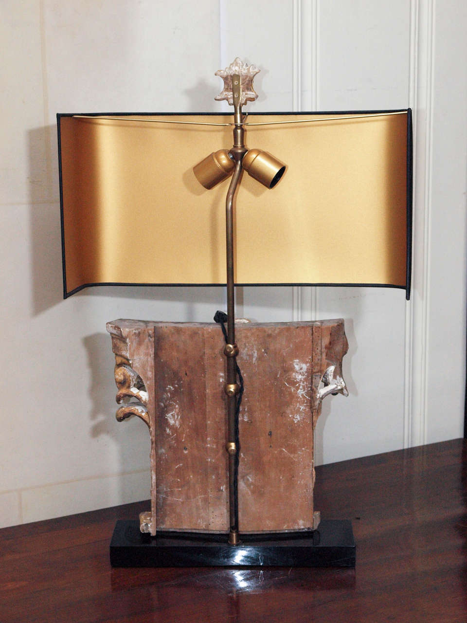 Architectural gilded fragment lamp on ebony base